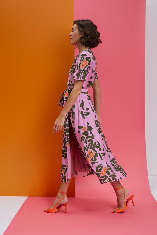 in a mood-wrap tie up dress